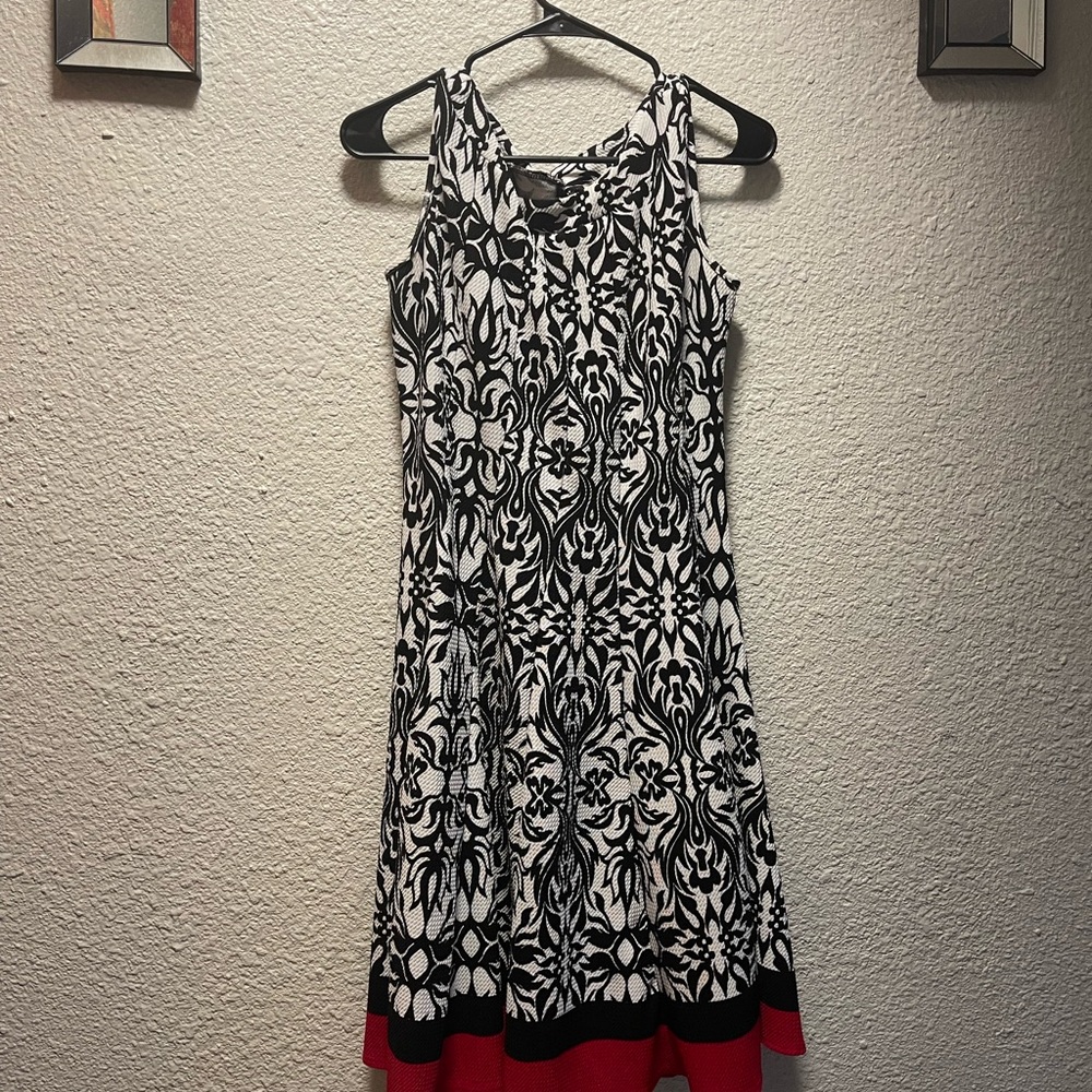 Elegant Black and White Sleeveless Dress with Red Hem